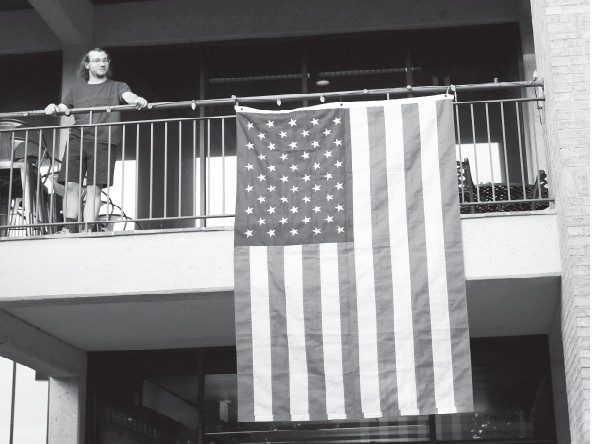 a-new-greenland-deal-same-american-concerns-1 American flag hanging on a building's facade.