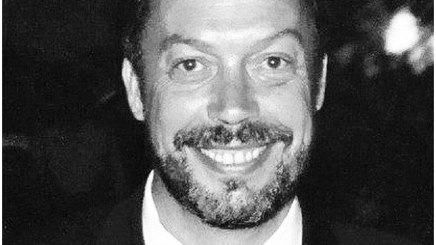 Tim Curry in a tuxedo and bow tie at the Emmys.