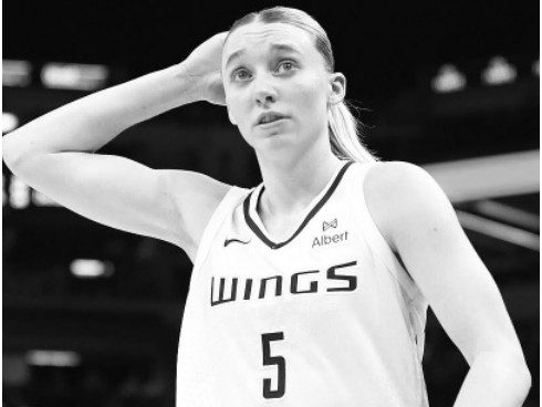 wnba-dallas-wings-end-their-season-1 A Dallas Wings basketball player in team jersey number 5.